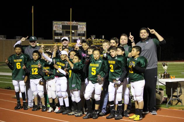 Members of the Snyder Packers pictured on the front row are (l-r) Cameron Smith, Cyrus Castillo, Adon Martinez, Aythen Tarin, Gavin Salinas, Shonne Thurmond, Colton Sands and Manuel Briones. On the back row are coach Gene Sands, Cody McCowen, Joseph Hernandez Jr., coach Skillett Rinehart, Ryder Garcia, Andres Torres, Izaiah Dominguez, Troy Botts III, coach Brandon Sands, A.J. Ruiz, coach Troy Botts Jr., Andrew Alonso and coach Andrew Porter.
