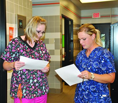 Ira ISD cafeteria manager Brittney Lomax, (left) discussed the diabetic menu items with school nurse Haley Cumbie.